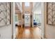 Inviting foyer with hardwood floors, decorative accents, and views of the living spaces at 1249 Austin Thomas Dr, Dacula, GA 30019