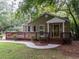 Charming single story brick home with a large front porch and well-maintained landscaping at 2380 Strathmore Dr, Atlanta, GA 30324
