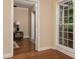 Hallway area featuring hardwood flooring, neutral wall color, and large window view to outside at 2380 Strathmore Dr, Atlanta, GA 30324
