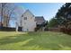 Exterior backyard view of a two-story home with a deck and a lush green lawn at 274 Sleepy Hollow Rd, Powder Springs, GA 30127
