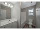 Bathroom with a tub and shower combo, single sink vanity, and tile flooring at 274 Sleepy Hollow Rd, Powder Springs, GA 30127