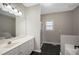 Bathroom with double vanity, glass door shower, and tile flooring at 274 Sleepy Hollow Rd, Powder Springs, GA 30127
