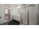 Bathroom with shower, vanity, and doorway view to spacious bedroom at 274 Sleepy Hollow Rd, Powder Springs, GA 30127