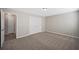 Neutral bedroom featuring gray carpet, and double door closet perfect for relaxation at 274 Sleepy Hollow Rd, Powder Springs, GA 30127
