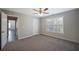 Spacious bedroom featuring a ceiling fan, window, and neutral paint, offering comfort and style at 274 Sleepy Hollow Rd, Powder Springs, GA 30127