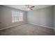 Bedroom with window, neutral paint, and carpeted floors at 274 Sleepy Hollow Rd, Powder Springs, GA 30127