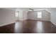 Bonus room featuring hardwood floors, two windows, and a ceiling fan at 274 Sleepy Hollow Rd, Powder Springs, GA 30127