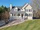 Two-story home with a welcoming front porch and well-maintained lawn at 274 Sleepy Hollow Rd, Powder Springs, GA 30127