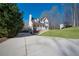 Charming home on a well maintained green lawn with a long concrete driveway at 274 Sleepy Hollow Rd, Powder Springs, GA 30127