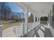 Inviting covered front porch with classic white columns and ample space for seating at 274 Sleepy Hollow Rd, Powder Springs, GA 30127