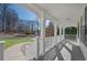 Inviting covered front porch with classic white columns and ample space for seating at 274 Sleepy Hollow Rd, Powder Springs, GA 30127