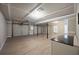 Spacious garage with tile flooring and ample space for parking and storage at 274 Sleepy Hollow Rd, Powder Springs, GA 30127
