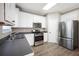 Bright kitchen featuring stainless steel appliances, sleek countertops, and ample cabinet space at 274 Sleepy Hollow Rd, Powder Springs, GA 30127