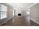 Bright living room with a fireplace, large windows, and neutral wall paint at 274 Sleepy Hollow Rd, Powder Springs, GA 30127