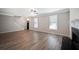 Spacious living room featuring beautiful wood floors, a cozy fireplace, and ample natural light at 274 Sleepy Hollow Rd, Powder Springs, GA 30127