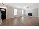Inviting living room with a fireplace, large windows, and modern floors at 274 Sleepy Hollow Rd, Powder Springs, GA 30127