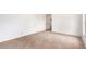 Carpeted bedroom featuring entry doors, a window and a large area for furniture at 100 Walnut Ct, Stockbridge, GA 30281