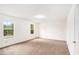 This airy bedroom offers natural light, a closet and new carpet at 100 Walnut Ct, Stockbridge, GA 30281