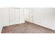 The room features neutral carpet and walls and a double door closet at 100 Walnut Ct, Stockbridge, GA 30281