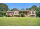 Charming single-story home with well-maintained lawn, stone accents, and a welcoming front porch at 100 Walnut Ct, Stockbridge, GA 30281