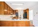 Classic kitchen featuring wood cabinetry, white countertops, and black appliances at 100 Walnut Ct, Stockbridge, GA 30281