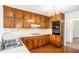 Functional kitchen with wood cabinets, white countertops, and essential appliances at 100 Walnut Ct, Stockbridge, GA 30281
