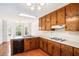 Traditional kitchen with wood cabinets, white countertops, and a breakfast nook by the window at 100 Walnut Ct, Stockbridge, GA 30281