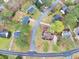 An aerial view of houses and properties with tree coverage at 2050 Plantation Rd, Lawrenceville, GA 30044