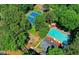 A nice community outdoor pool and tennis court from above at 2050 Plantation Rd, Lawrenceville, GA 30044