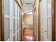 Hallway view of an elegant bathroom with a freestanding tub and vanity at 2050 Plantation Rd, Lawrenceville, GA 30044