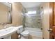 Updated bathroom featuring tiled shower with glass surround, sink, and toilet at 2050 Plantation Rd, Lawrenceville, GA 30044