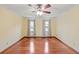 Spacious bedroom featuring hardwood floors, crown molding, and natural light at 2050 Plantation Rd, Lawrenceville, GA 30044