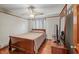 Bedroom with a ceiling fan, hardwood floors, and a large window for ample light at 2050 Plantation Rd, Lawrenceville, GA 30044