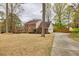 Traditional brick house with two-car garage and a long driveway situated on a spacious lot at 2050 Plantation Rd, Lawrenceville, GA 30044