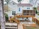 Back exterior of home with a two-tiered deck and patio space at 2050 Plantation Rd, Lawrenceville, GA 30044