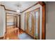 Elegant foyer with stained glass door, hardwood floors and decorative trim for a luxurious entry experience at 2050 Plantation Rd, Lawrenceville, GA 30044