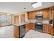 Well-lit kitchen with modern appliances, granite countertops, and tile floors for a seamless cooking experience at 2050 Plantation Rd, Lawrenceville, GA 30044