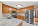Kitchen with granite countertops, stainless appliances, and tile floors offering a modern and functional space at 2050 Plantation Rd, Lawrenceville, GA 30044