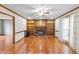 Bright living room boasts hardwood floors, built-in bookshelves, and a cozy fireplace at 2050 Plantation Rd, Lawrenceville, GA 30044