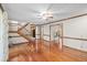 Large living room with hardwood floors and multiple entryways at 2050 Plantation Rd, Lawrenceville, GA 30044