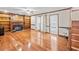 Spacious living room featuring hardwood floors, a fireplace, and built-in bookshelves at 2050 Plantation Rd, Lawrenceville, GA 30044