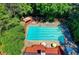 Aerial view of a large outdoor pool surrounded by trees and lounge chairs at 2050 Plantation Rd, Lawrenceville, GA 30044