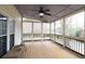 Spacious screened-in porch with ceiling fan and wooded views at 2050 Plantation Rd, Lawrenceville, GA 30044