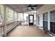 Spacious screened-in porch with wooded views, ceiling fan and neutral color scheme at 2050 Plantation Rd, Lawrenceville, GA 30044