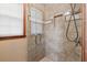 Walk-in shower with glass door, tiled walls, window and shower head at 2050 Plantation Rd, Lawrenceville, GA 30044