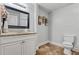 Cozy bathroom featuring a granite vanity top, decorative wall art, and neutral paint at 2224 Bridle Ct, Norcross, GA 30071