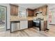 Updated kitchen featuring stainless steel appliances, stone backsplash and wood cabinets at 2224 Bridle Ct, Norcross, GA 30071