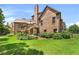 A large backyard featuring a lush lawn, mature landscaping, and a deck perfect for outdoor enjoyment at 3284 Kylee Dawn Cir, Lawrenceville, GA 30045