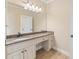 Bathroom featuring granite countertop vanity with drawers and cabinets providing ample storage space at 3284 Kylee Dawn Cir, Lawrenceville, GA 30045