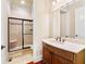 This bathroom features a tiled shower and modern fixtures and vanity at 3284 Kylee Dawn Cir, Lawrenceville, GA 30045
